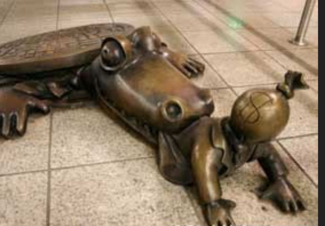 This statue of a reptile dragging a child into a sewer is located in Brooklyn, New York.
The same borough where the underground tunnels under the Synagoge were found in January 2024.
The child's head depicted as a money bag. 
Child trafficking is the biggest business in the world