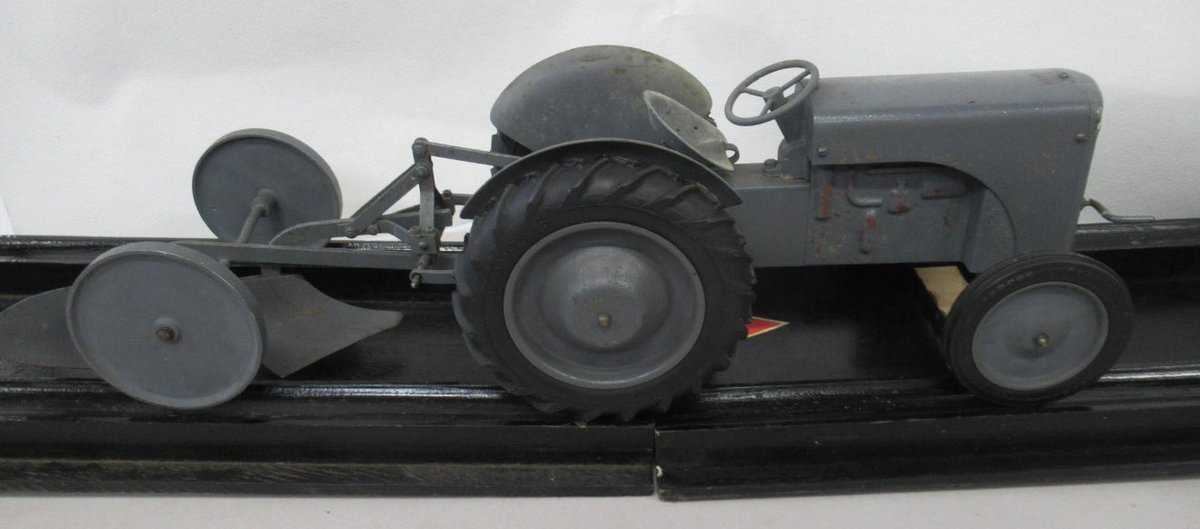 I just love this 

A Massy Ferguson working demonstration model tractor by Mills Models c 1950. 

Coming up in our September Sale.
(My father would also have loved it!)