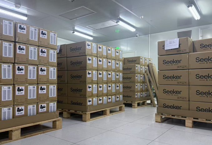 Stacks of Solana Seeker boxes ready for shipping in a warehouse