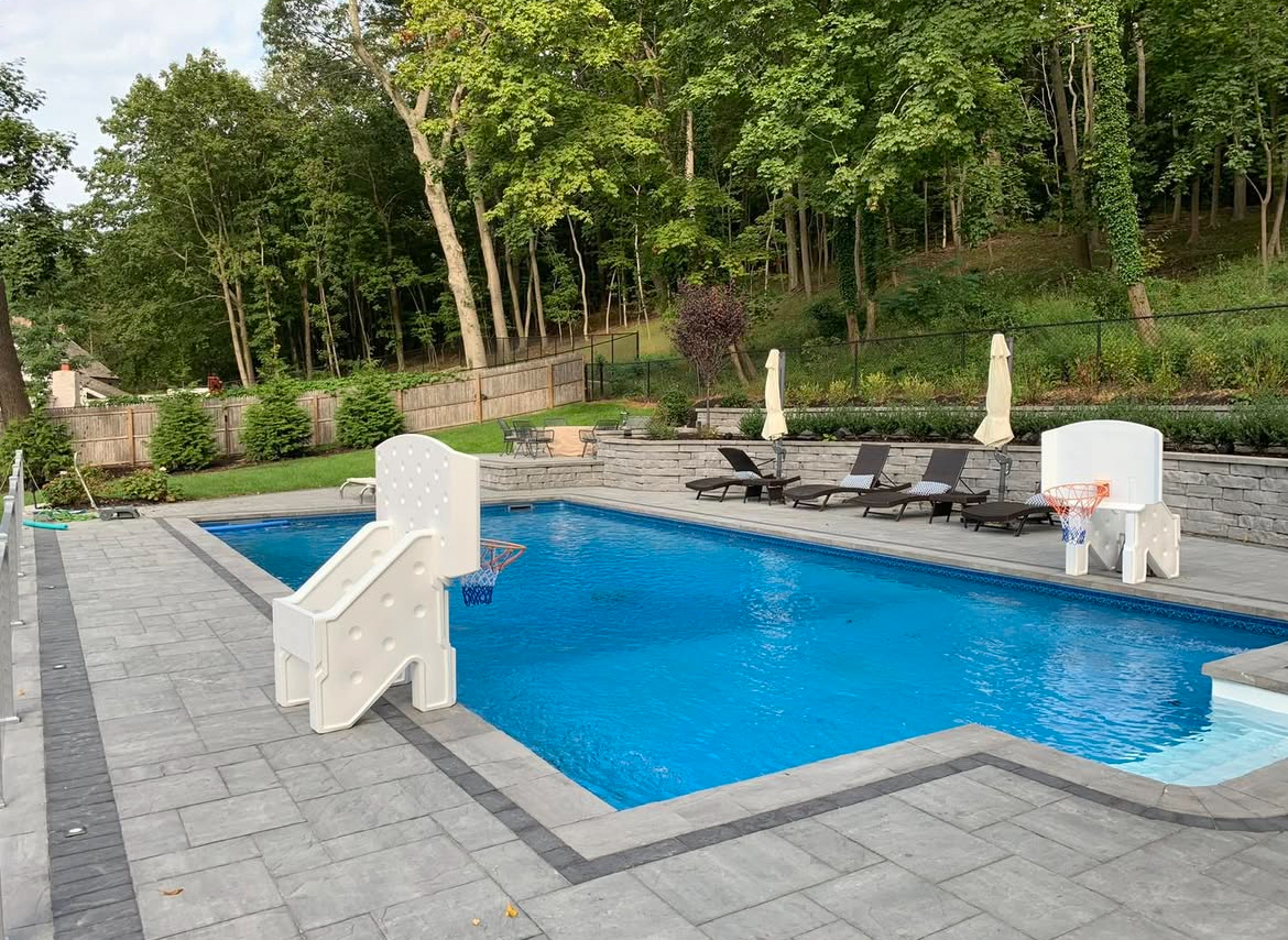 This elevated patio and pool design by Flawless Masonry features sleek Cambridge Pavers, clean retaining walls, and a layout perfect for relaxing, entertaining, or making family memories by the pool.

#CambridgePavers #FlawlessMasonry #LuxuryLandscaping