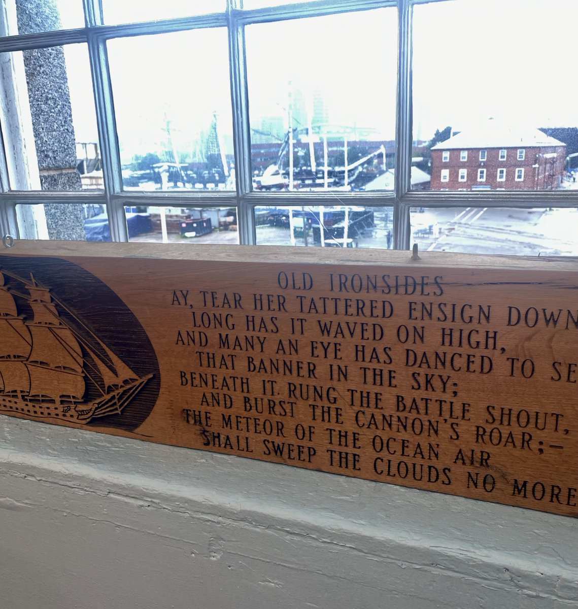 On our Museum windowsill, you can read Oliver Wendell Holmes Sr.’s rallying cry, “Ay, tear her tattered ensign down!” and look beyond to see why the nation refused. USS CONSTITUTION still flies that ensign and tells the story of American resolve. 🇺🇸 
#USNavy #Navy250 #Boston