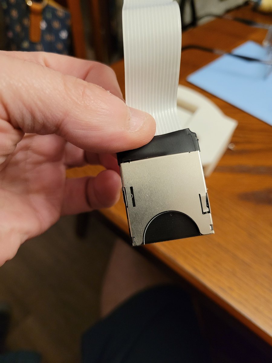 Lord_Wompus's tweet image. So my GDEmu needed a cover and after 4 hours of print time, I popped this guy out and applied some highlights with markers. Fed the SD card ribbon adapter through, printed out a reset button and snapped it into the Dreamcast. Came out nice!
Thanks @RetroJeff83 for the file link!