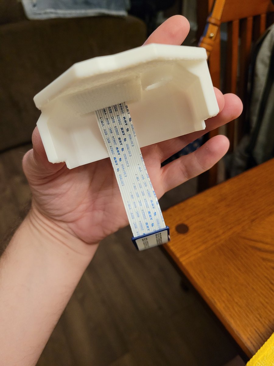 Lord_Wompus's tweet image. So my GDEmu needed a cover and after 4 hours of print time, I popped this guy out and applied some highlights with markers. Fed the SD card ribbon adapter through, printed out a reset button and snapped it into the Dreamcast. Came out nice!
Thanks @RetroJeff83 for the file link!