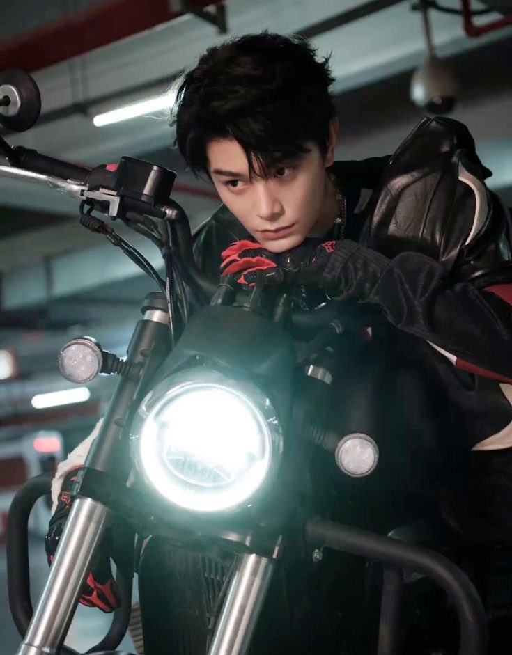 Title: Fix What You Ride 🏍️
Characters: #DingYuxi and #ShenYue
Author: Nana ( me <3)

Chapter 1: Fox in the Rain
The neon lights of Chongqing bled into the rain-slick streets, painting everything in electric reds and ghostly blues.