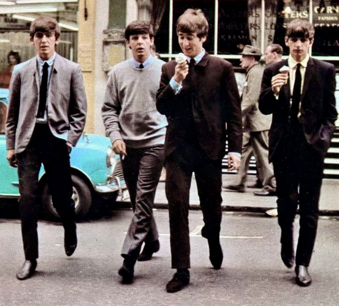 Enjoying the ice cream while strolling in Soho, London, July 1963.