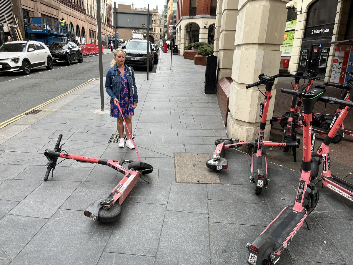 barton_kell's tweet image. Two different days. Two different stations. Same old story.
E-scooters dumped across the pavement in #Liverpool, blocking safe routes for #blind people like me.

We deserve better.

#AccessibilityMatters #BlindNotInvisible #SaferStreets #Liverpool