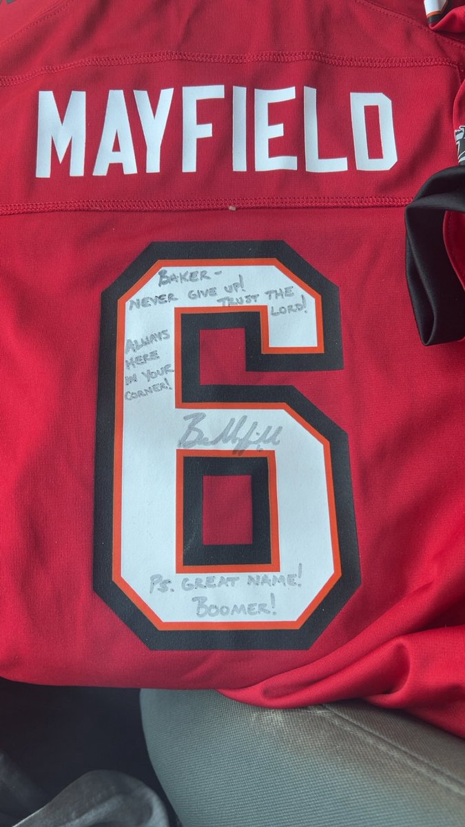 CoachMac09's tweet photo. I want to give a HUGE thank you to whoever put this awesome gift to Baker in my truck yesterday! Also a HUGE  shoutout and thank you to @bakermayfield for taking the time out to not only sign it but write encouraging words for our little super hero! #Boomer https://t.co/CveBVVMGK2