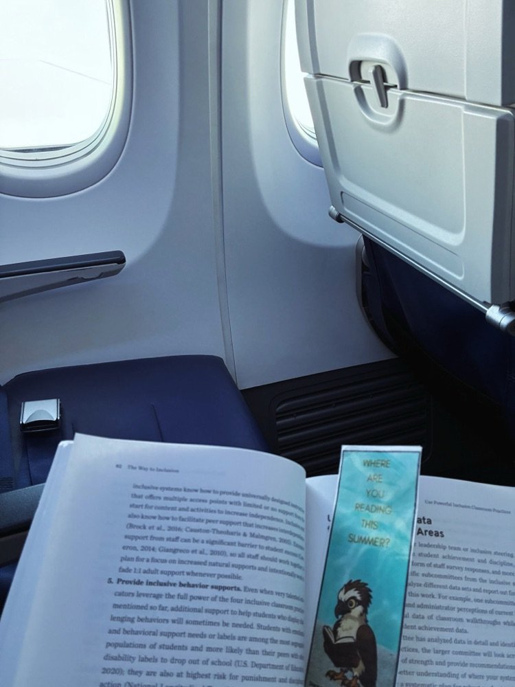Ms. Fenn is reading on her flight back from Denver! Where are you reading this summer? Want to participate? Link in bio. #ParkPRIDE #BelongGrowSucceed #SummerReading