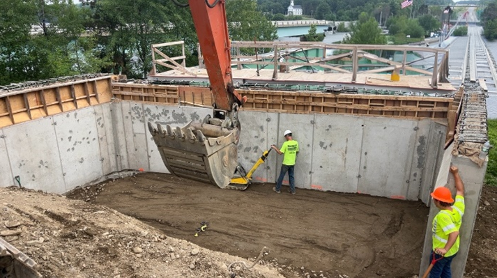 MaineDOT1's tweet photo. The Medway I-95 Bridge Deck Replacement is racing ahead! Crews are in action, hoisting overhang brackets and decking onto the iconic Vaughan Daggett Memorial Bridge over the Penobscot River, while the Route 116 Bridge sees rapid deck upgrades.
#MaineDOT #TransportationTuesday https://t.co/xLsXUIubng