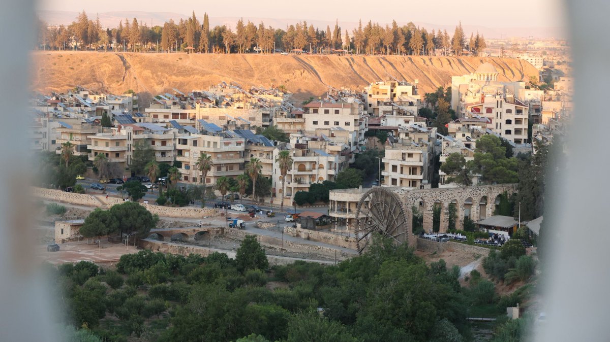 #Syria: picturesque view of #Hama-city (noria &amp; Citadel).