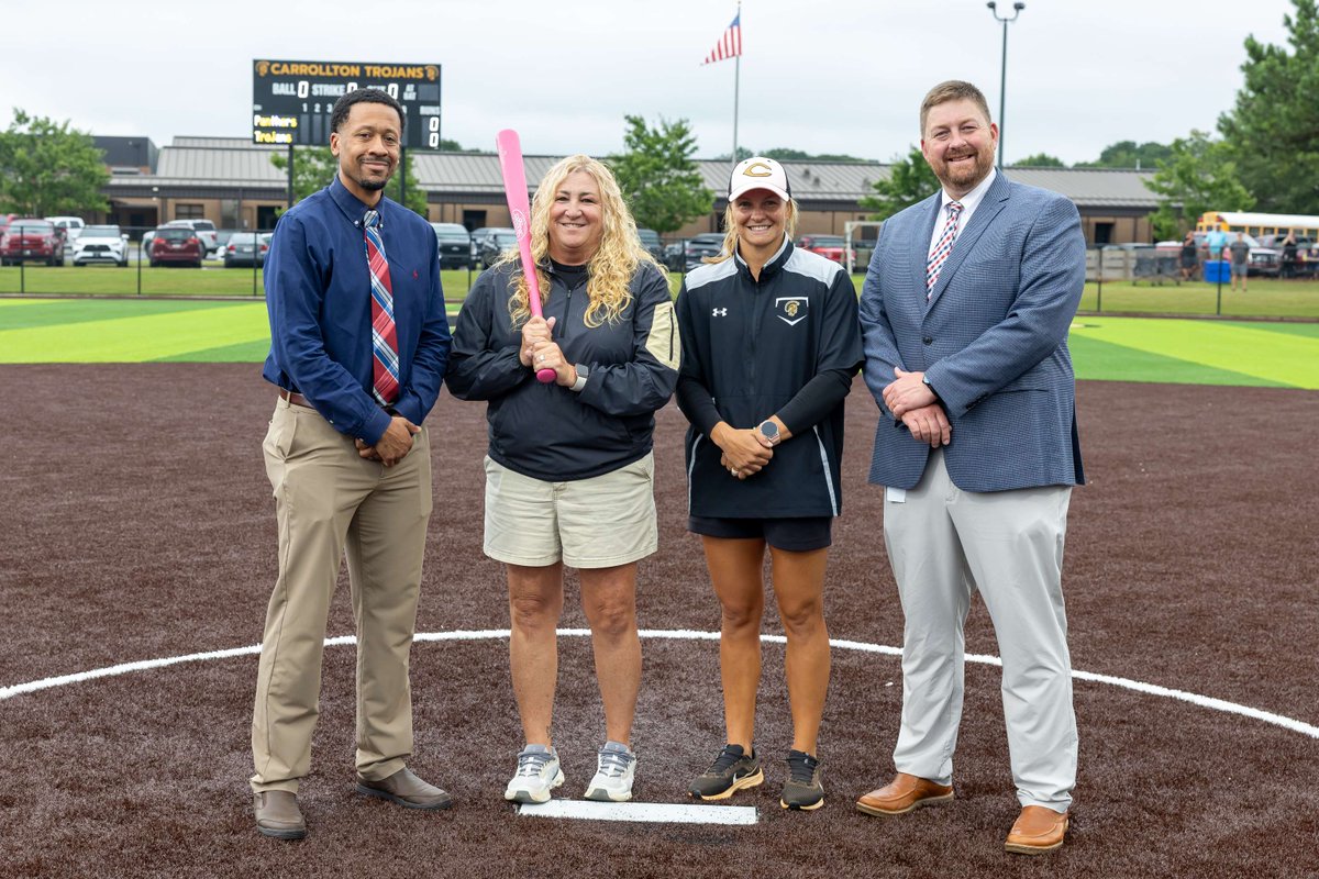 The Trojan softball program honored former head coach and current CMS head coach Lisa Phillips before tonight's season opener! They presented her with a pink bat in recognition of her induction into the GADC Hall of Fame! #GoldStandard