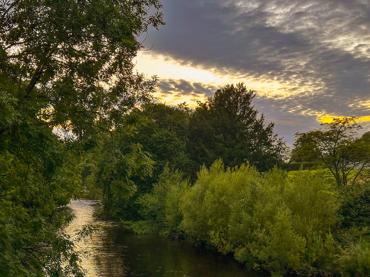 Storm Floris bowing out with scalloped skies and a slash of sunset.