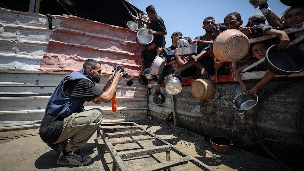 In the most emotional and authentic picture of the year, a photographer in Gaza happened to pass a crowd of civilians, who at that very moment were coincidentally waiting with an assortment of empty pots and pans.
