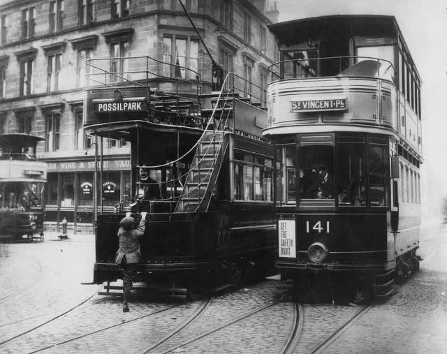 Balmore Rd/Saracen St intersection  with 2 electric trams, one  open-topped, the other a 'Standard',  The image illustrates a safety device.  GCA