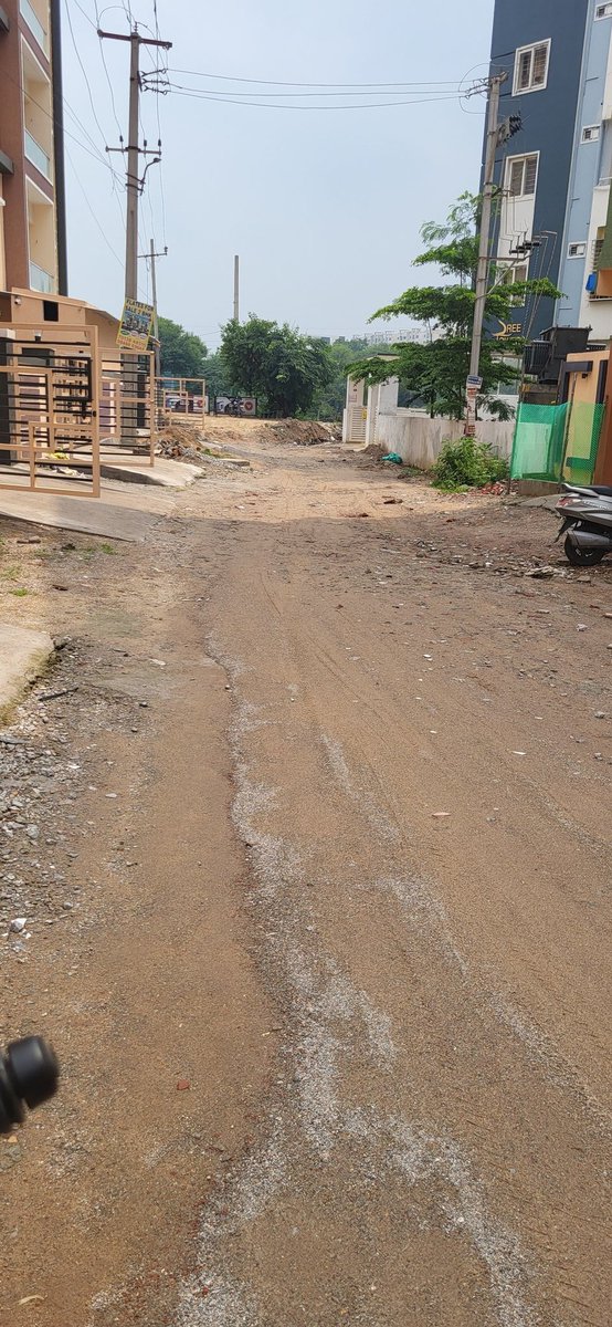 Viva0135's tweet photo. It’s been 2 years since our building was constructed, and yet the road outside remains in terrible condition. Even after multiple complaints to HMWSSB, there’s been no action, no update.Every time it rains, the area gets flooded, making it unsafe and unhygienic. https://t.co/5eyCa9Tr4j