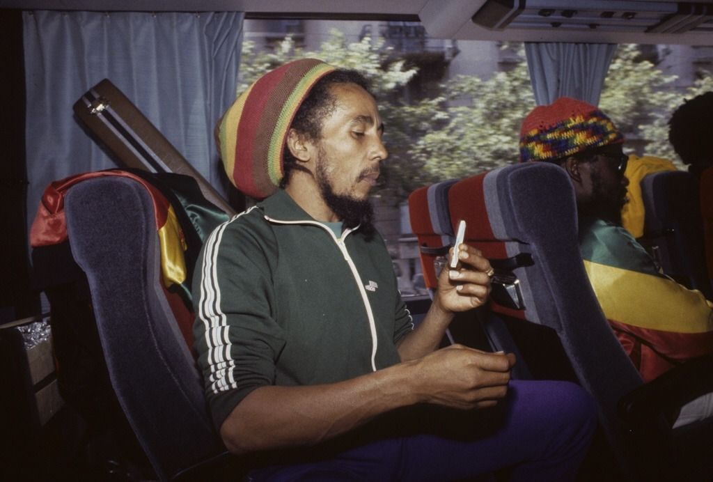 Bob Marley rolling up a joint