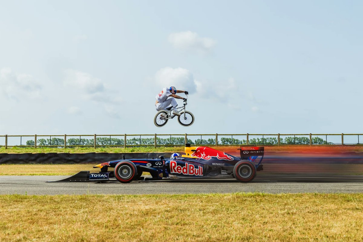 Kriss Kyle Jumps a BMX Bike Over a Moving F1 Car Driven by David Coulthard bikerumor.com/kriss-kyle-jum…