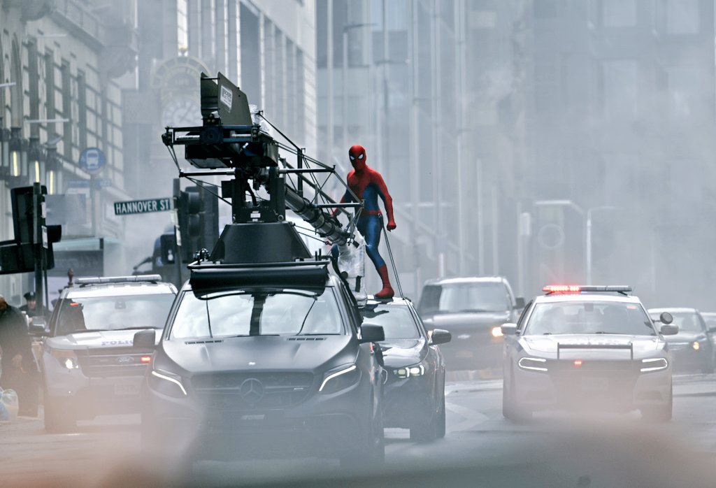 thefandomfeed's tweet image. High-speed chaos!
A new set photo from Spider-Man: Brand New Day reveals a thrilling car chase scene in action — Spidey clinging on as sparks fly. 👀
This one’s going to be intense.
#SpiderManBrandNewDay
#Carchase #setphoto 
👉 Follow for more behind-the-scenes updates!