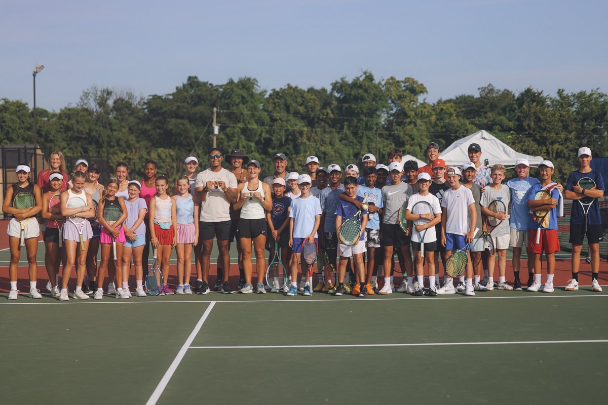 Coach Jamichael and Coach Sofia winning the largest trophy around town.
