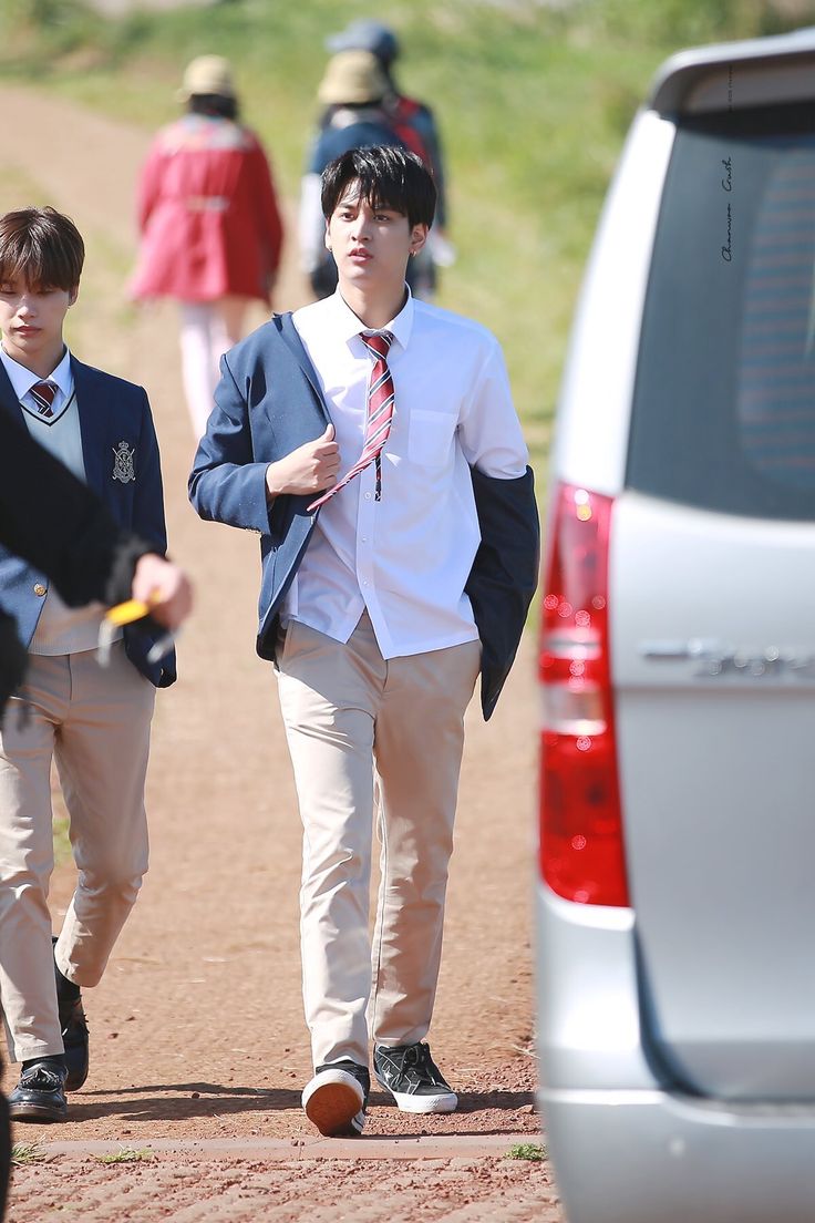 it's so cool to see all these different sides of us, from when we're all dressed up in our school uniforms to the more serious moments in our suits.
