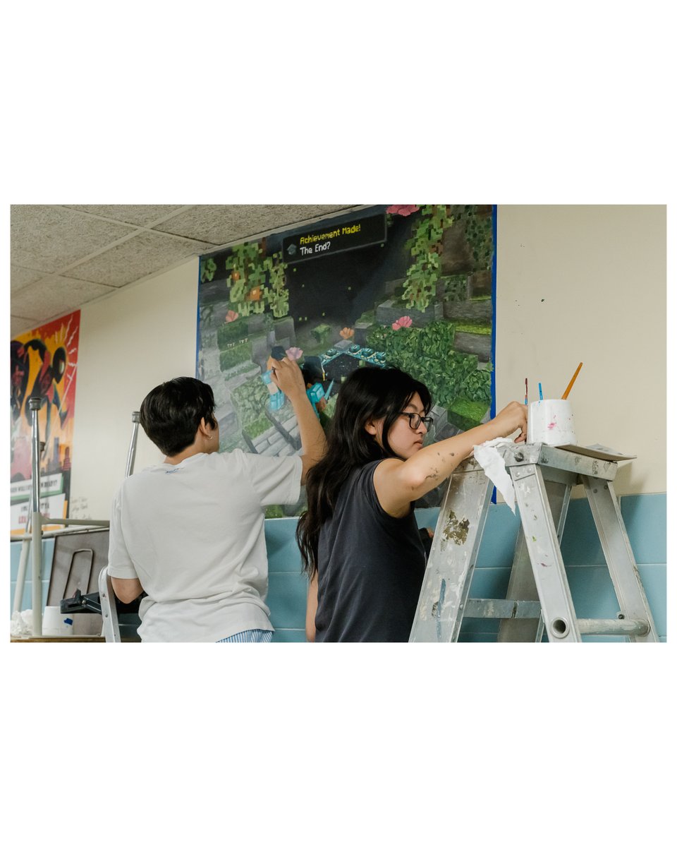 Class of '25 grads Gianna Fernandez &amp; Mabel Deng are painting the senior mural they designed themselves! Their creativity is a shining example of the arts education at Bethpage HS. 🎨👏 Come check it out! #BethpagePride #ArtsInEducation #ClassOf2025