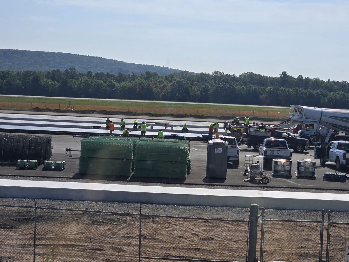 Looking for some help here. I work next to an AFB in MA which is cool as shit, they are redoing the runway. Can anyone tell me what the long concrete "lanes" are? This pic is a little old, there are more of them now...