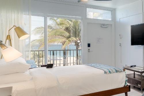 Looking for a grown-up getaway with style? Our 21+ beachside bungalows offer a low-key vibe with welcome drinks, ocean-inspired art, and total relaxation. #PlungeBeachResort #LauderdaleByTheSea