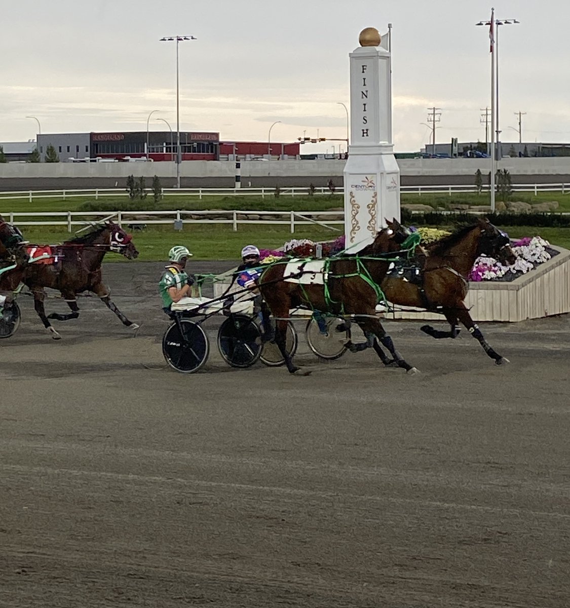 A light rain was no problem for Mike Hennessy, holding off a challenge from Titanic Hanover and driving Wicked Feeling for the win in race #3 and a natural hat trick!