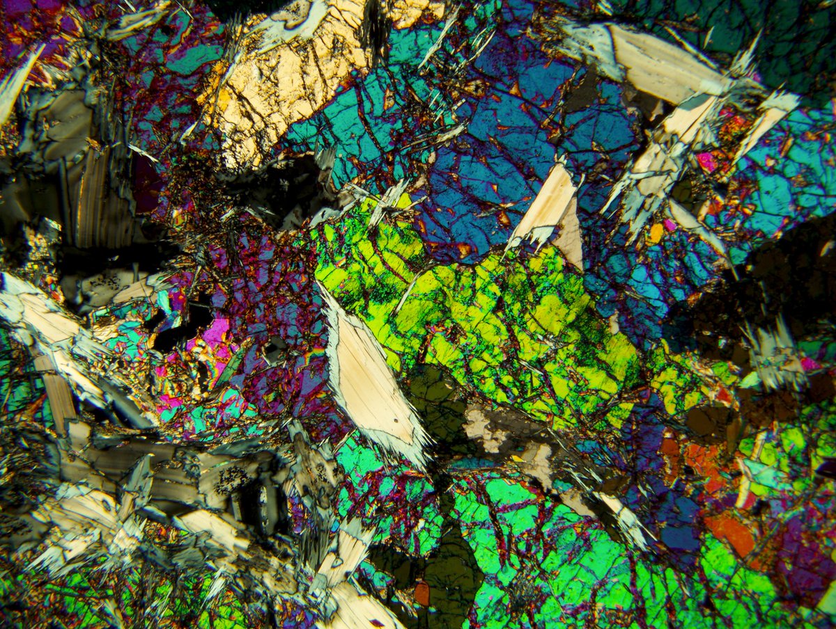 Mineralogical Society of America (@minsocam) on Twitter photo Let’s revisit some images sent to me previously by Cody Steven. PLM photomicrograph in XPL of a metaperidotite from western Idaho. Clinochlore is mantled by 2-layer antigorite, and overprints elongate olivine crystals. FOV is 2mm. #thinsectionthursday Let’s revisit some images sent to me previously by Cody Steven. PLM photomicrograph in XPL of a metaperidotite from western Idaho. Clinochlore is mantled by 2-layer antigorite, and overprints elongate olivine crystals. FOV is 2mm. #thinsectionthursday