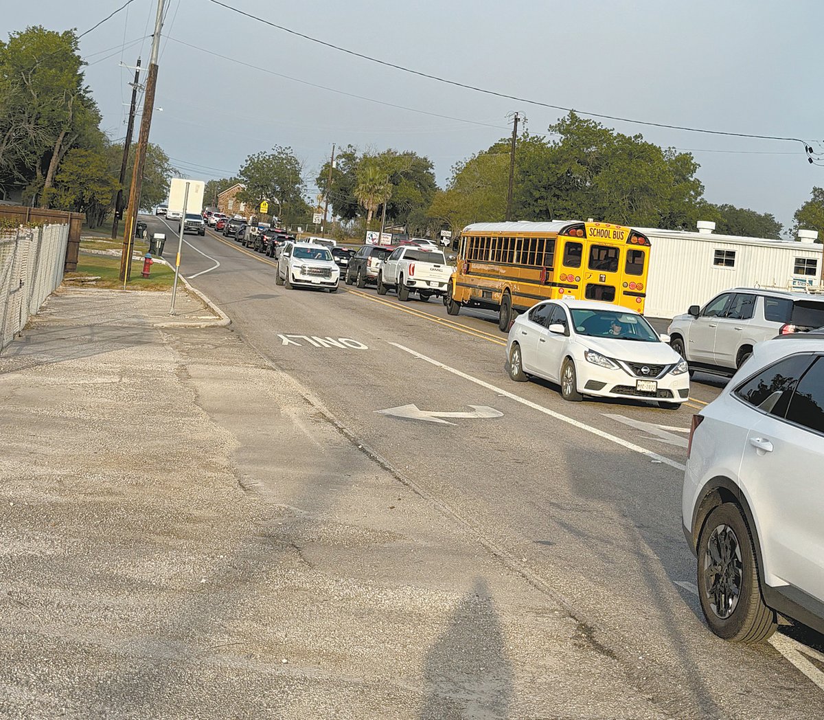 wcnonline's tweet image. A La Vernia Independent School District (ISD) bus full of students is among the vehicles idling Aug. 4 on Bluebonnet Road (F.M. 775) after turning off U.S. 87 near Koepp Chevrolet, waiting to deliver students to La Vernia junior high and high school campuses for their first da...