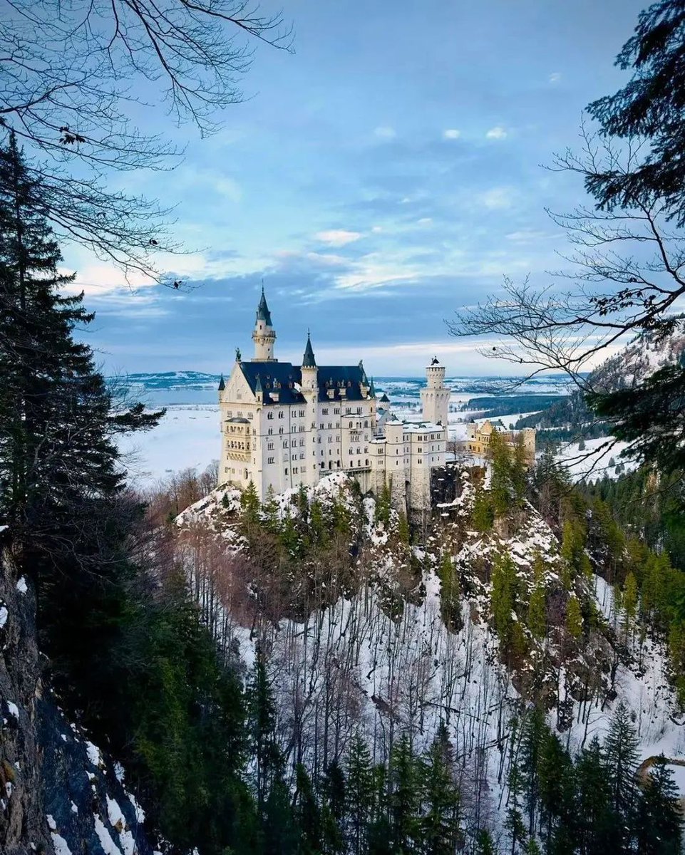 Neuschwanstein Castle, perched majestically on a rugged hill in Bavaria, Germany, is a quintessential fairytale edifice that exudes an enchanting allure.