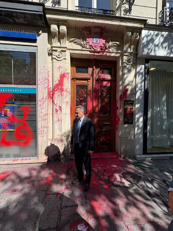 The Israeli ambassador to France in front of the El Al offices in Paris after they were vandalized.