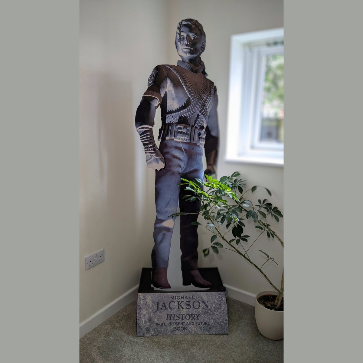 michaeljackson's tweet photo. Fan Allison Tidswell shared her Michael Jackson cardboard cutout which was part of the in-record store promotion for the HIStory album. She writes: “he now stands in my living room in pride of place. Crazy to think it’s 30 years old!”. #MJCollectables https://t.co/OhQLY9sI0N https://t.co/aJecKYfTPp