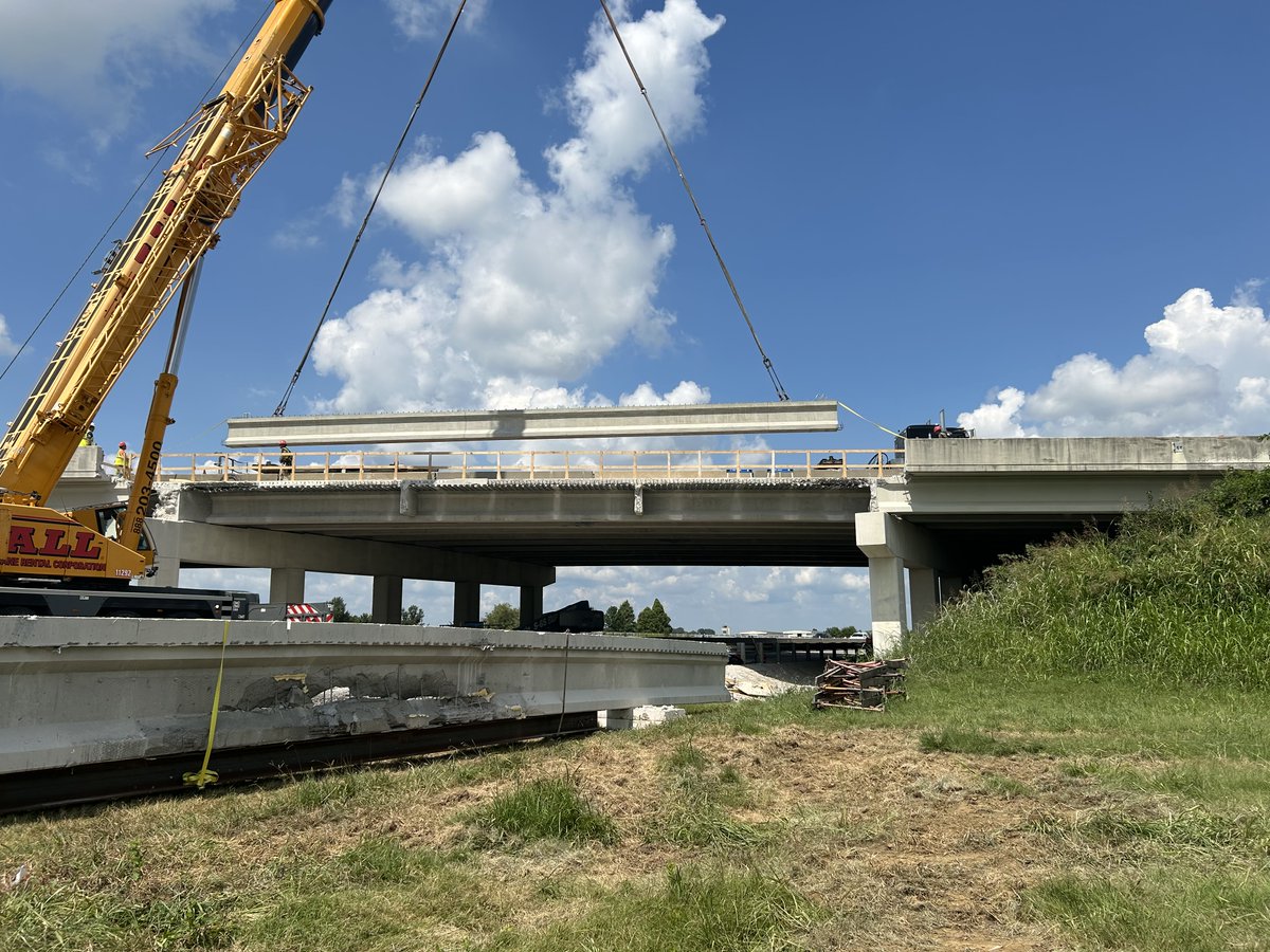 A new prestressed concrete beam was placed on the Carter Road Bridge over U.S. 60 in Owensboro on Wednesday. The old beam, damaged in a bridge strike last summer, can be seen in the foreground.