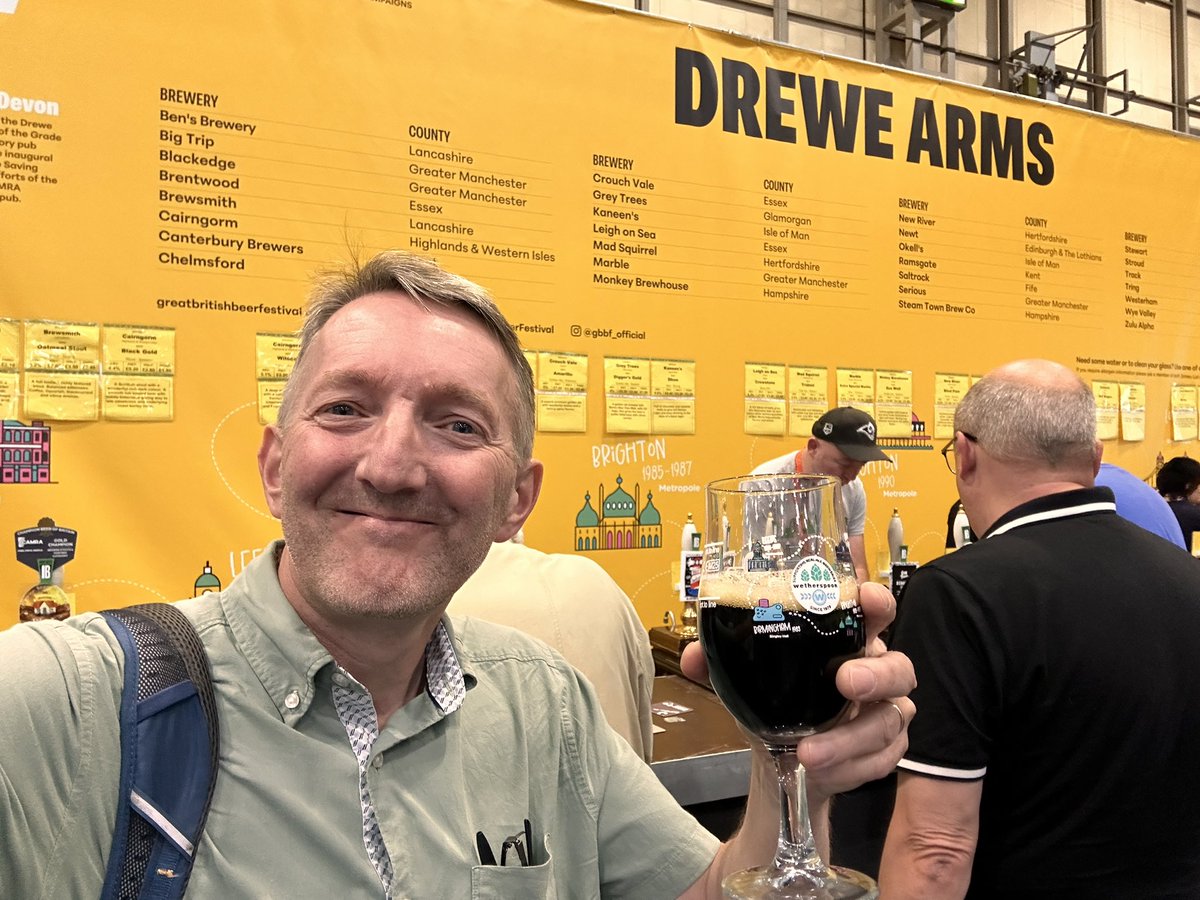 CliveBGS's tweet photo. Caught up with a few @CAMRA_Official friends at @gbbf - continued my odyssey through the #CBOB beers - currently enjoying Black Gold (4.4% ABV) @cairngormbrew #CheersToBrew https://t.co/w8mTaz0IYP