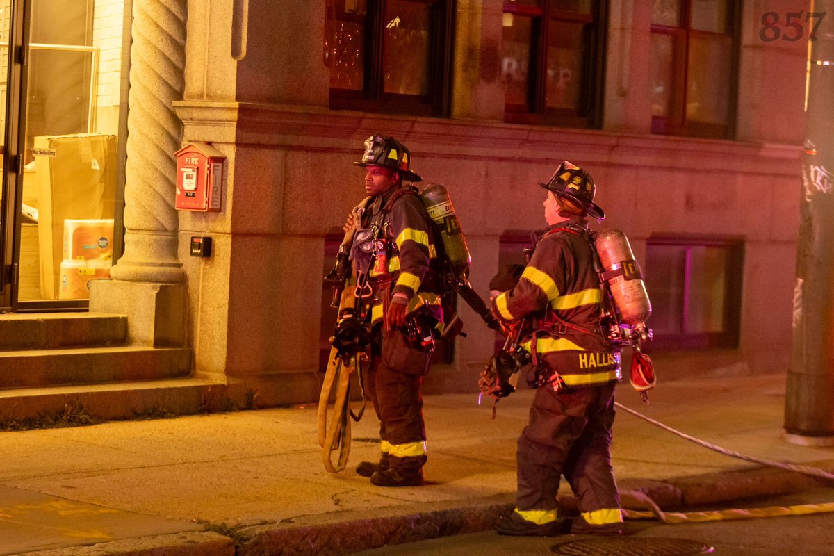 Cambridge Firefighters stretch lines and go to work at a reported structure fire in a 7 story OMD on Mt. Auburn St in Harvard Square. Upon investigation, an issue was isolated to a ceiling-mounted electrical unit, with no fire.