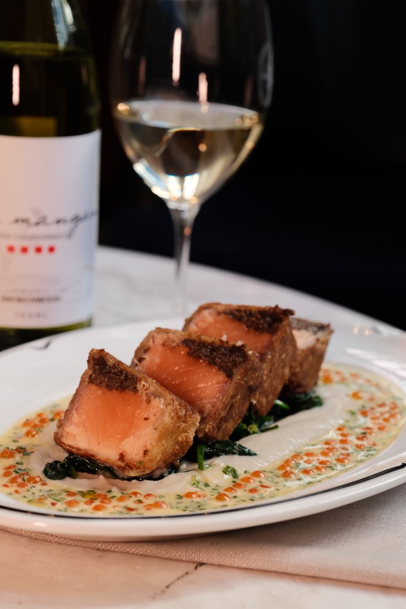 Serving now at Luke's Kitchen⁠
Salmon wellington with garlic spinach, salmon caviar &amp; beurre blanc, accompanied by a crisp class of Luke Mangan Chardonnay. ⁠
⁠
It's Friday, why not? 🥂