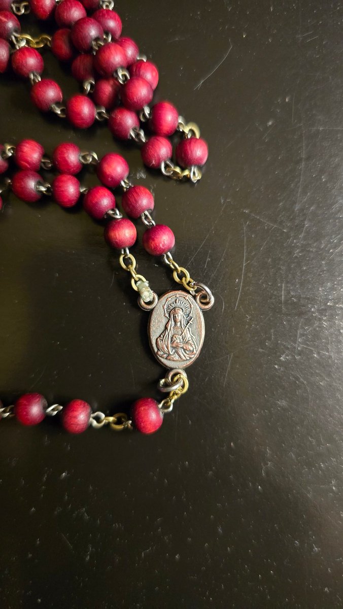 My grandma and I exchanged rosaries today, and she gave me this beautiful one with Jerusalem's cross and Mater Dolorosa