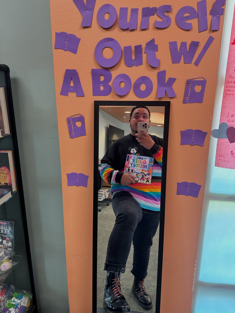 Check yourself out… with a book 😉🍭🌈🩷🎀 

Getting more confident so I figured I would share my little ootd with my pride spirit jersey pride docs &amp; queer history book! 

Ft: The ABC’s of Queer History!

#vtuber #library