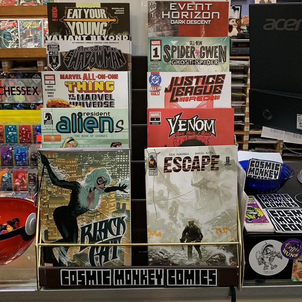 Our featured rack has some great new first issues! #blackcat #escape #residentalienthebookofchanges #venomblackwhiteandblood #marvelallinonethethingvsthemarveluniverse #justiceleaguered #talesoftheshadowmen #allnewspidergwentheghostspider #eatyouryoung #eventhorizondarkdescent