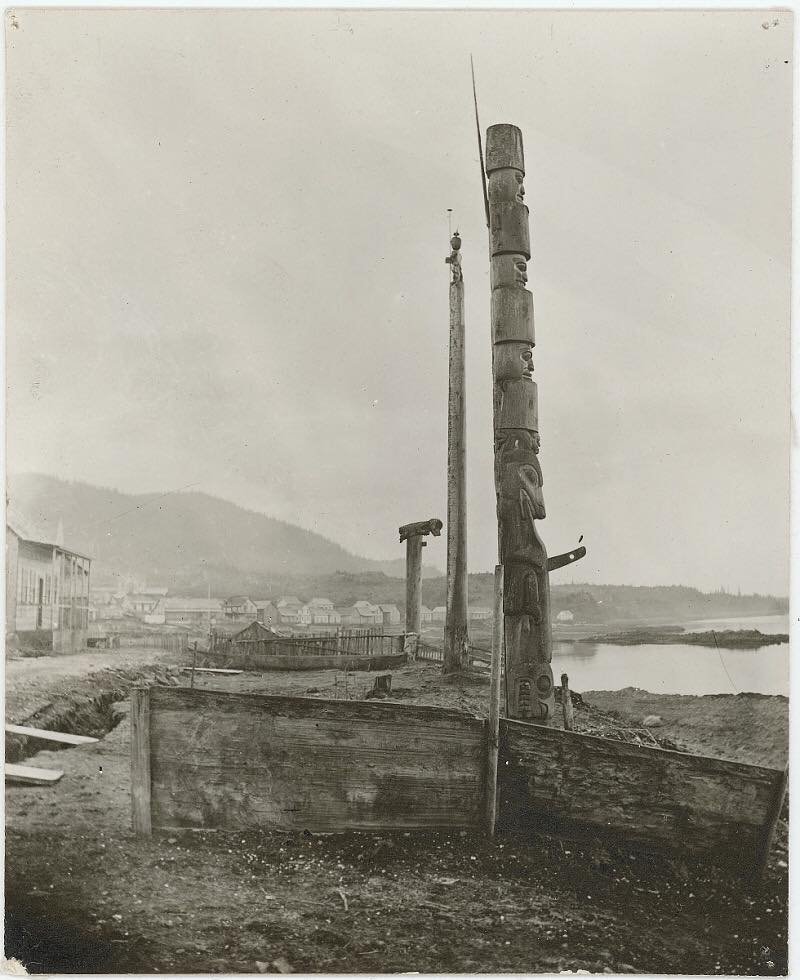 Tsimshian poles at Lax Kw’alaams Port Simpson photograph taken by Richard Maynard in 1874.