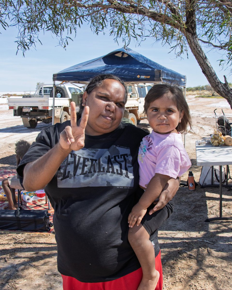KJMartu's tweet photo. At Jila-Jila, #MartuFamilies from the #KJWomensAndFamiliesProgram in #Punmu spent the day #OnCountry. The kids explored Country then played Martu Snakes + Ladders, created by the #KJLanguage Team, to learn animals from #MartuCountry in #MartuWangka. #KeepingCultureStrong https://t.co/OSbRuYHl1f