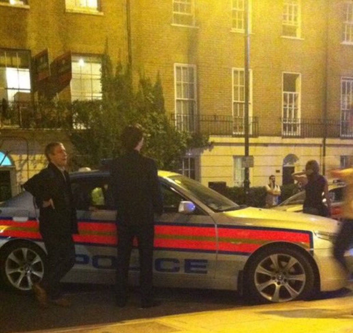 SmerlockSmolmes's tweet image. Why does it lowkey look like Sherlock is pissing against the police car