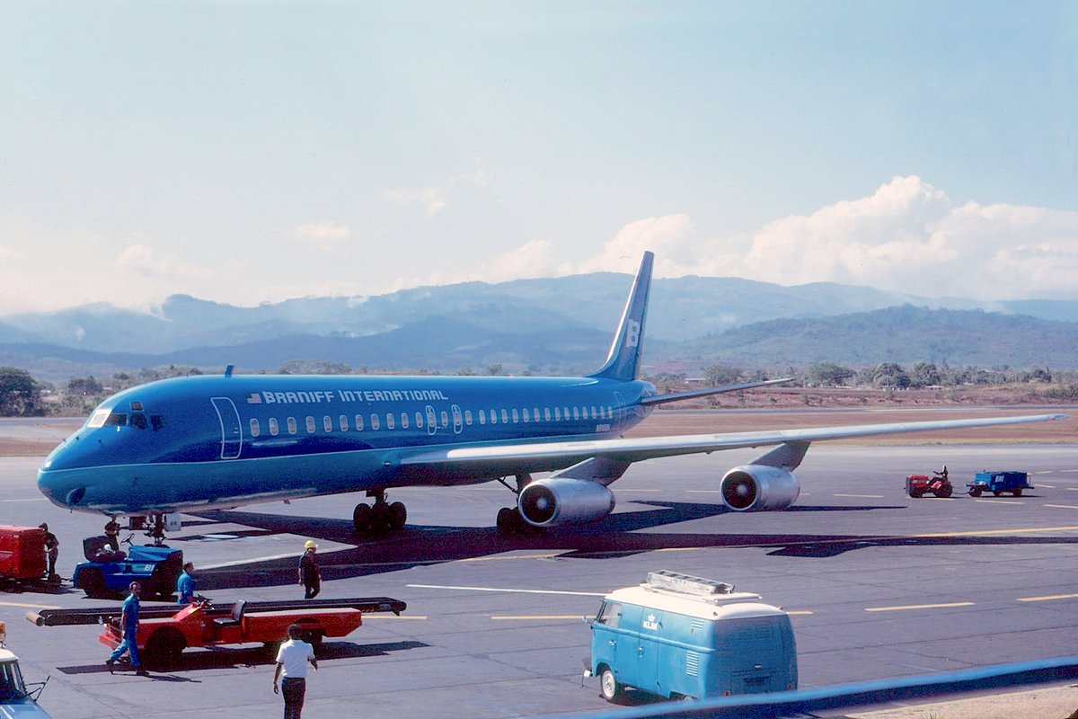 BRANIFF IN SOUTH AMERICA THE COLLECTION OF J. ESCOBAR - Braniff International McDonnell Douglas DC-8-62 Intercontinental Jet registered as N810BN is parked on the ramp at Bogota El Dorado Airport, Colombia, in April 1977. The Legend of South America is painted in the 1971 Glenn