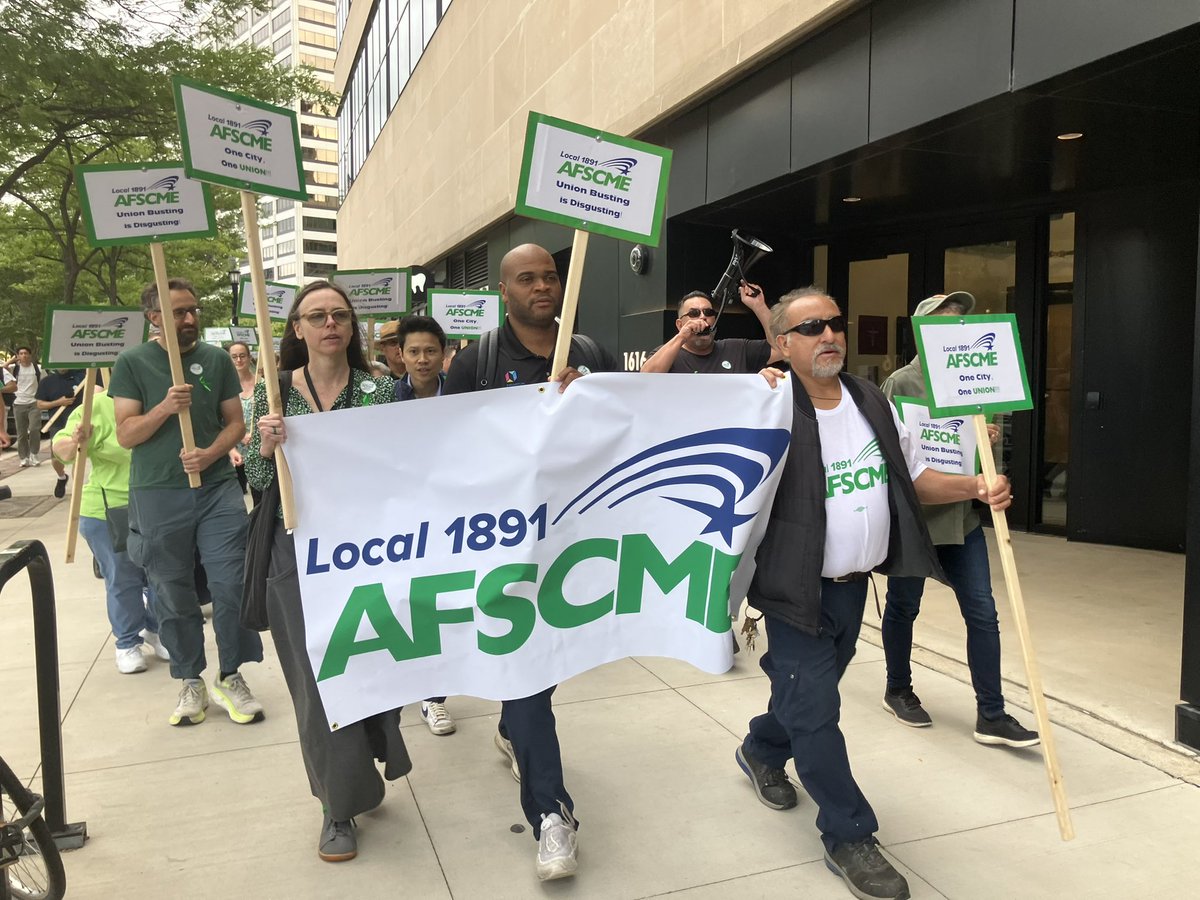 With chants of “ One City, One Union,” members of AFSCME Local 1891 marched from Fountain Square to the regular Library Board meeting Wednesday, voicing opposition to a plan officials are exploring to separate the library from the city.
