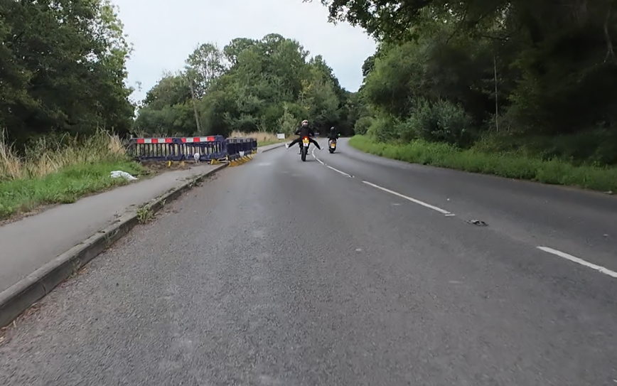 *something about cyclists not riding with their hands on the handlebars*