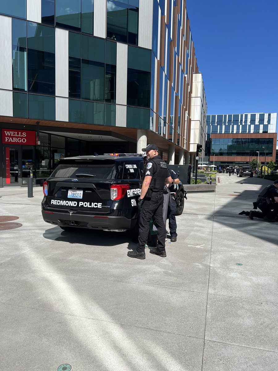 RedmondWaPD's tweet photo. 18 arrested for various charges during a protest at Microsoft Campus

Redmond police are at the scene of a demonstration at the Microsoft campus. On Aug 20, around 12:15 p.m., Redmond officers were dispatched to a large gathering of protestors in the Microsoft courtyard. 

Officers initially attempted to trespass the protestors, but they resisted and became aggressive. 

A few protesters had poured paint over the Microsoft sign and on the ground. 

Others had blocked a pedestrian bridge and were using stolen tables and chairs from vendors to form a barrier. 

Officers took 18 into custody for multiple charges, including trespassing, malicious mischief, resisting arrest, and obstruction. No injuries were reported. 

Thank you to Washington State Patrol, Bellevue, WA Police Department, and Kirkland Police Department for assisting during the incident. This is an ongoing investigation.