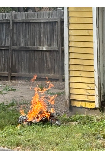Today we were called by a resident reporting smoke. We found a neighbour with this fire. Along with violating the burn ban it was not enclosed, contained banned materials, was too close to a structure &amp; had nothing at hand to put it out, all bylaw violations. Referred to police.