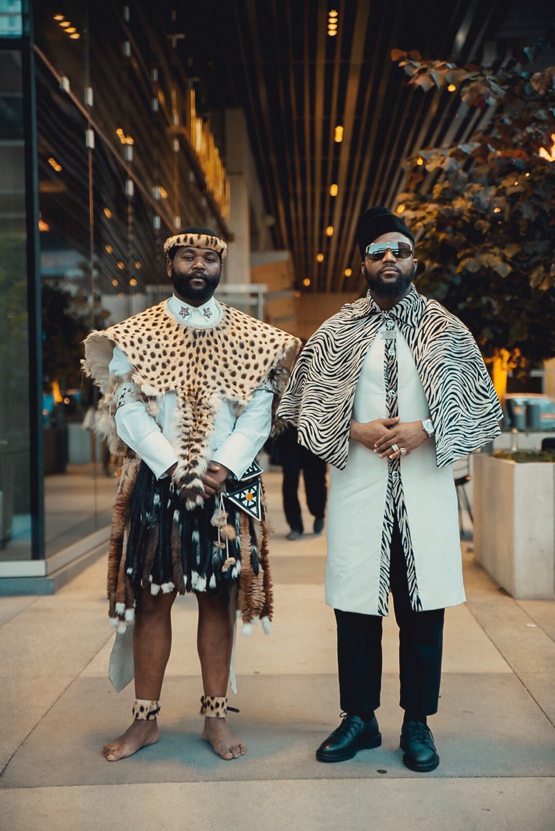 mahone_za's tweet photo. Throwback to Mahone The Quiet Junkie era: @thetrueteko in plaid fire, @casspernyovest rocking zebra capes &amp; harness suits! SA stars turned heads. As we rebrand to MHONE Leather Goods, share your fave memory with #MahoneMemories &amp; tag us! 🔥⚽🎤 #RebrandToMHONE https://t.co/wdqiSKP2v6