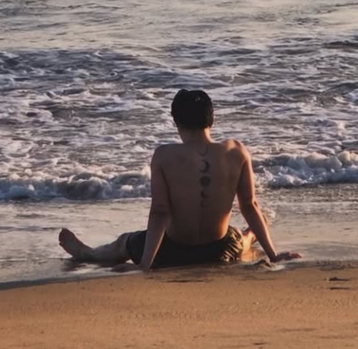 mninissaa's tweet photo. jimin on the beach with his moon tattoos on full display https://t.co/lmS6vLY8qj